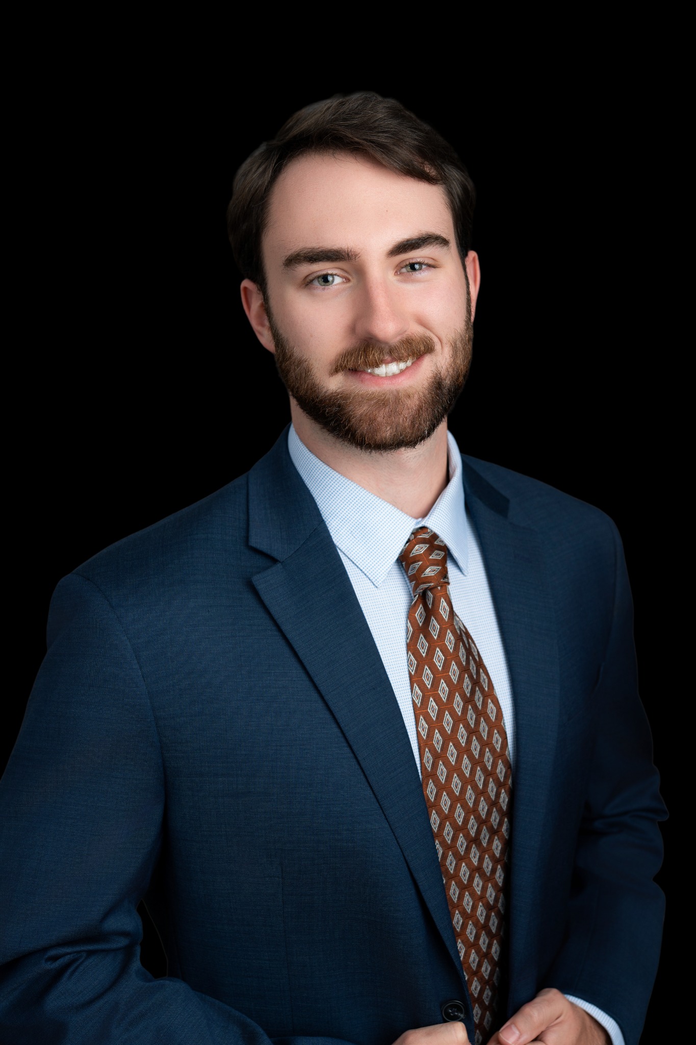 Polished professional portrait on a black background